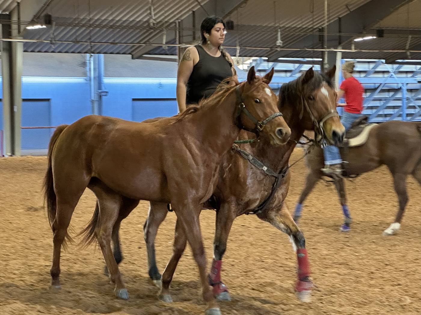 Horse and rider in the arena during a playday or barrel racing event